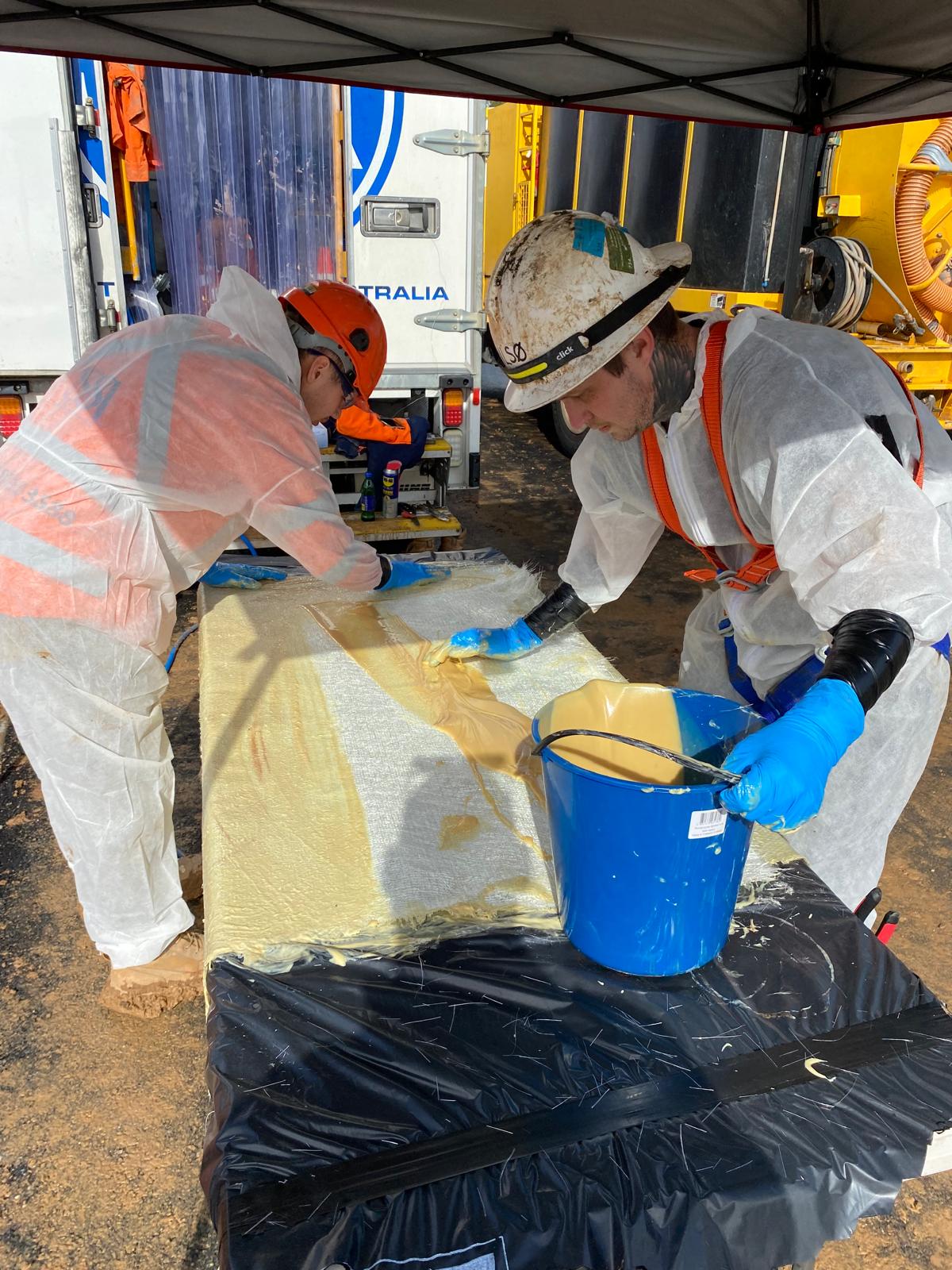 Two-part resin worked through the liner fabric during wet-out