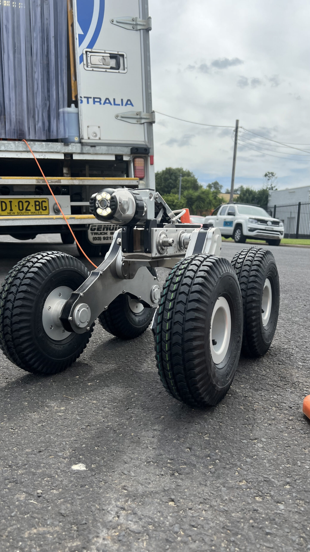 Six-wheel-drive HD crawler tethered from our CCTV truck